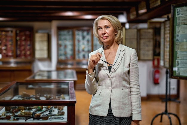 Woman exploring expositions in museum