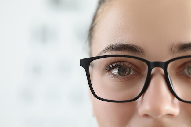 Woman face female wear glasses for better vision with black frame