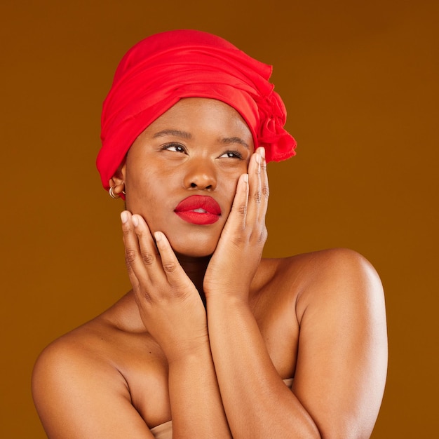 Woman face and hair scarf with skincare beauty makeup and haircare in studio Brown background African female person and cosmetics of a model with head wrap for culture with dermatology glow