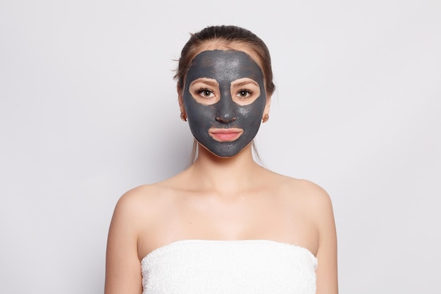 Woman Face Mask Portrait Of Beautiful Girl Removing Cosmetic Black Peeling Mask From Facial Skin Closeup Of Attractive Young Woman With Natural Makeup And Cosmetic Peel Mask On Face High Resolution