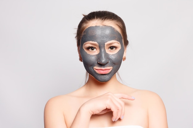 Woman Face Mask Portrait Of Beautiful Girl Removing Cosmetic Black Peeling Mask From Facial Skin Closeup Of Attractive Young Woman With Natural Makeup And Cosmetic Peel Mask On Face High Resolution