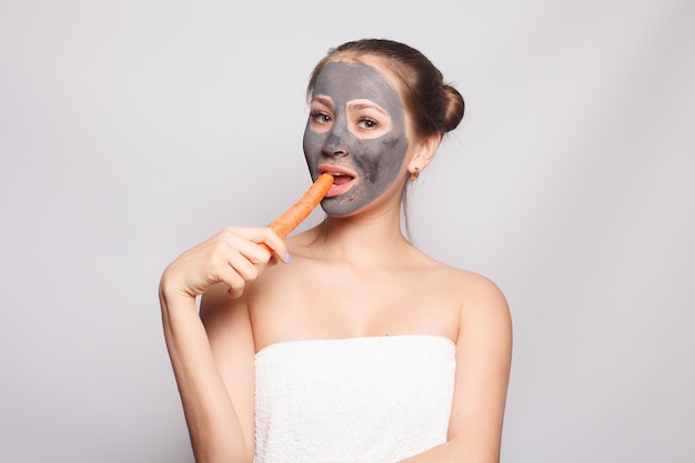 Woman Face Mask Portrait Of Beautiful Girl Removing Cosmetic Black Peeling Mask From Facial Skin Closeup Of Attractive Young Woman With Natural Makeup And Cosmetic Peel Mask On Face High Resolution