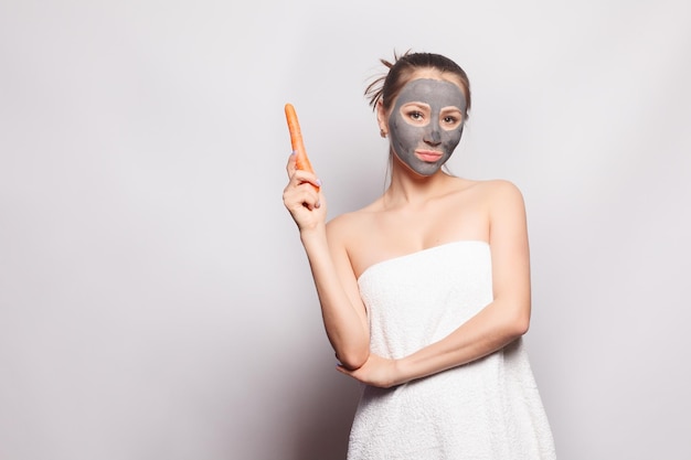 Woman Face Mask Portrait Of Beautiful Girl Removing Cosmetic Black Peeling Mask From Facial Skin Closeup Of Attractive Young Woman With Natural Makeup And Cosmetic Peel Mask On Face High Resolution