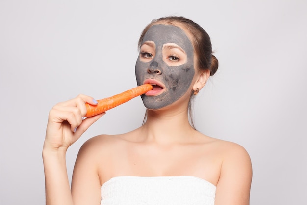 Woman Face Mask Portrait Of Beautiful Girl Removing Cosmetic Black Peeling Mask From Facial Skin Closeup Of Attractive Young Woman With Natural Makeup And Cosmetic Peel Mask On Face High Resolution