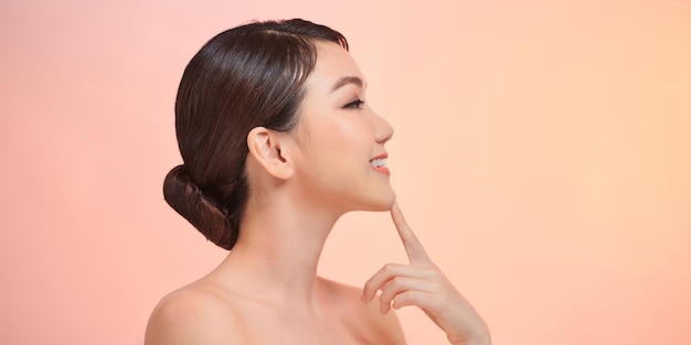 Woman face profile side view Chin lift pointing with index finger