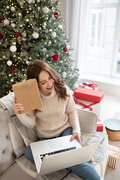 Woman feeling great while talking on videocall