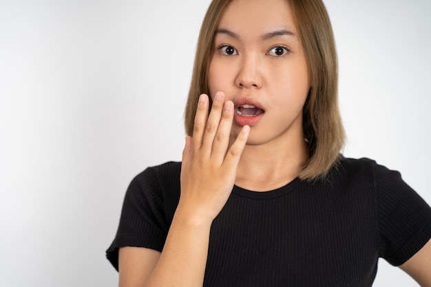 Woman feeling shocked and suprised over isolated background