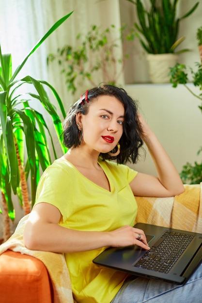 Woman female using typing on laptop keyboard working writing emails