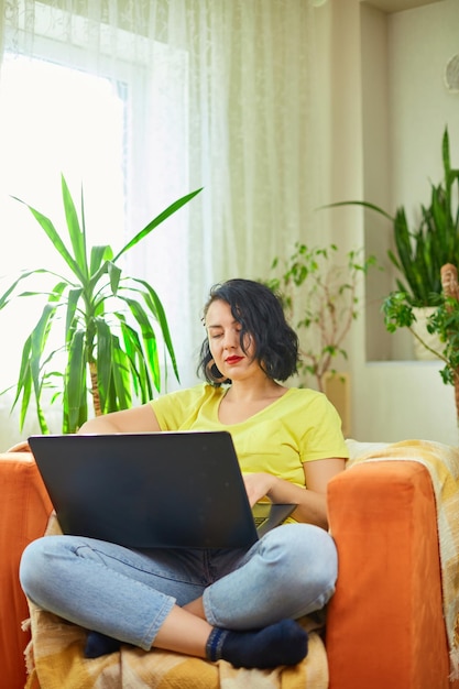 Woman female using typing on laptop keyboard working writing emails