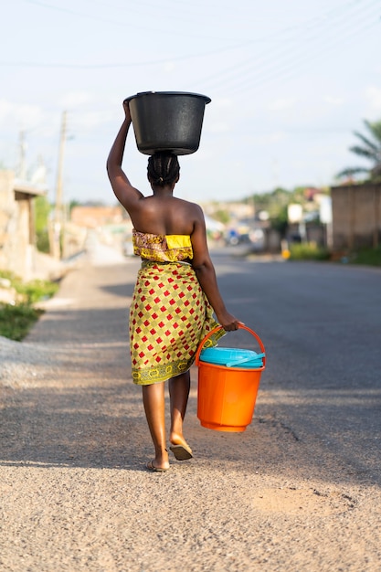 Woman fetching water from outdoors