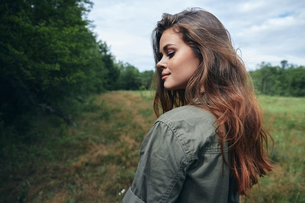 Woman in the field Cropped view of attractive smile fresh air travel