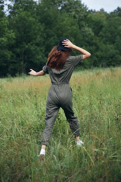 Woman in the field Walk in nature behind the fresh air t