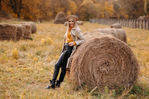 woman in a field with hay