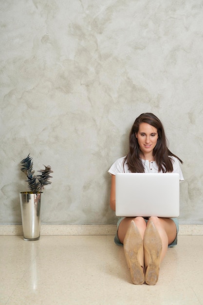 Woman on the floor with her laptop