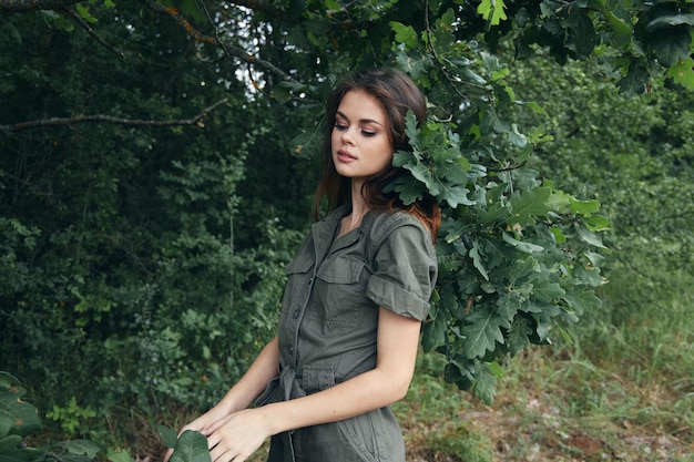 Woman in the forest Green leaves of a tree nature summer