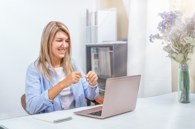 Woman freelancer working on laptop