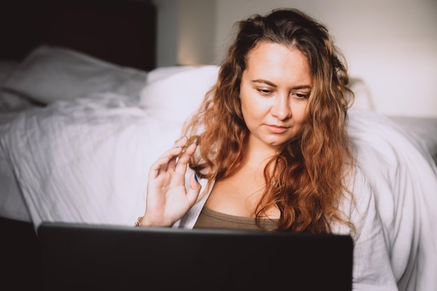 Woman freelancer working sitting with laptop with remote job