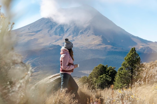 Woman in front of Popocatepetl Volcano