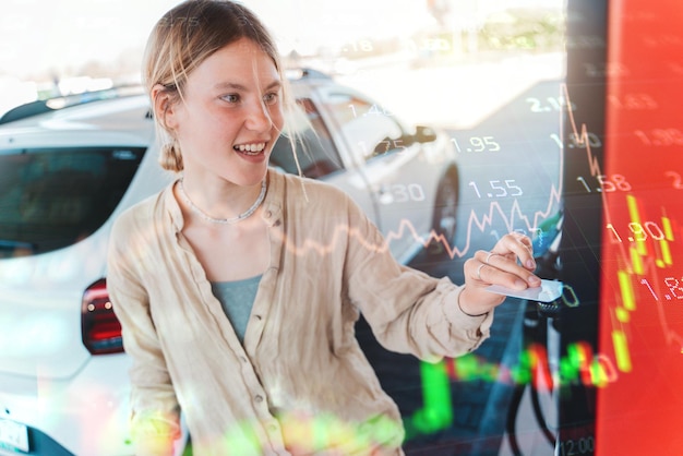 Woman at the gas station pays with the credit card