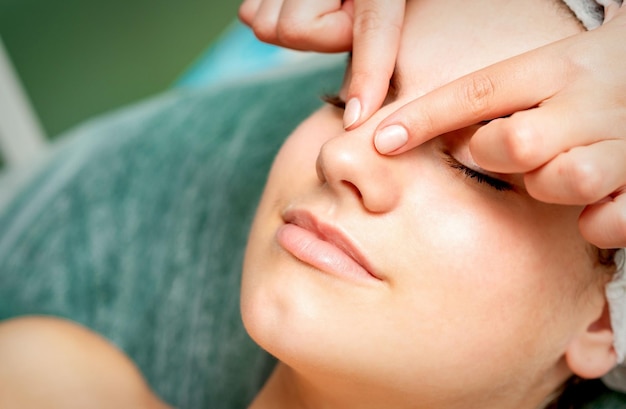 Woman Getting a Facial Massage in the Spa 243