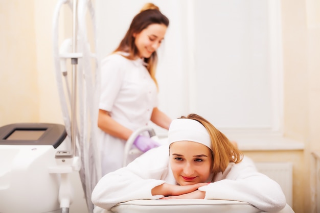 Woman getting LPG hardware massage at the beauty clinic