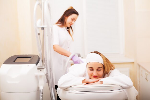 Woman getting LPG hardware massage at the beauty clinic