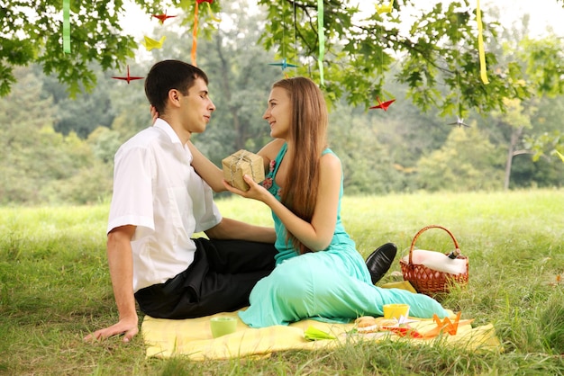 Woman gives a gift to his beloved man