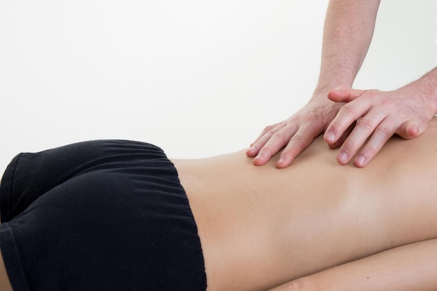 Woman giving back massage to a girl