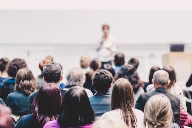 Woman giving presentation on business conference event