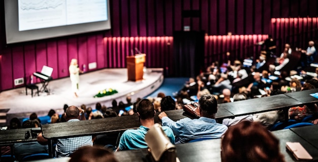 Woman giving presentation on business conference event