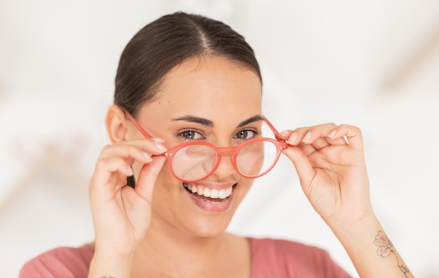 Woman glasses and portrait of shopping for spectacles in ophthalmology store for health and wellness Care retail and young female buying and trying eyewear and eyeglasses while in a optics store