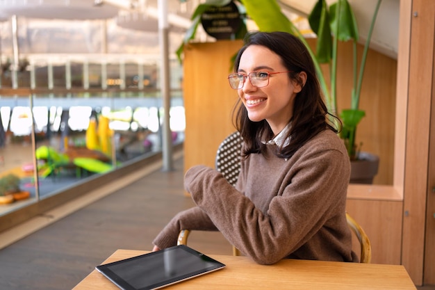 Woman in glasses with tablet computer