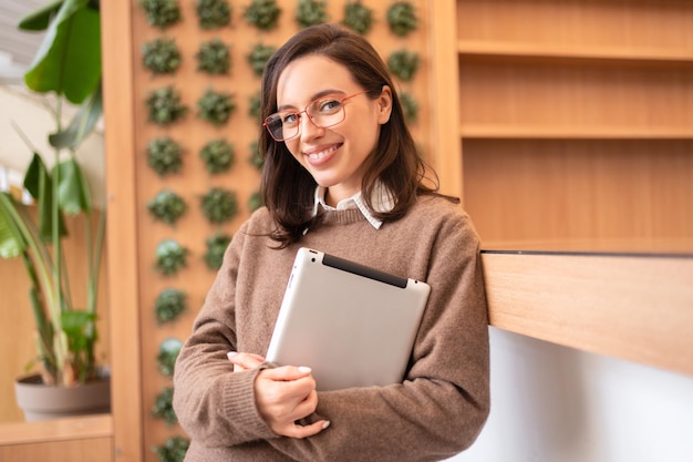 Woman in glasses with tablet