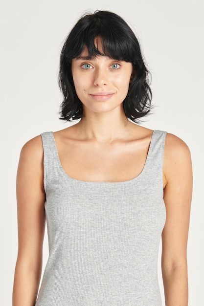 Woman in a gray sleeveless top