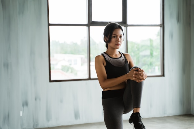 Woman at the gym doing stretching exercises