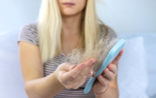 The woman hair is falling out Selective focus