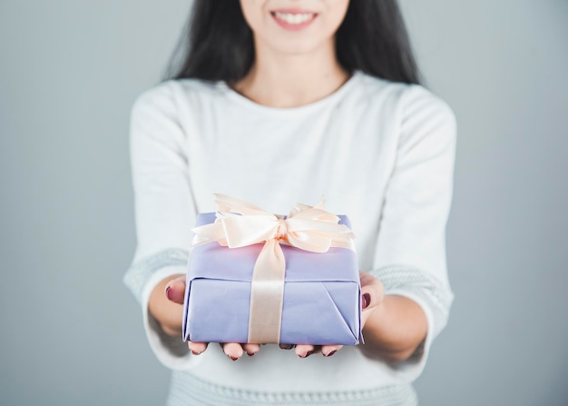 Woman hand gift box