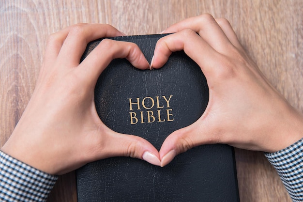 Woman hand heart sign in Bible