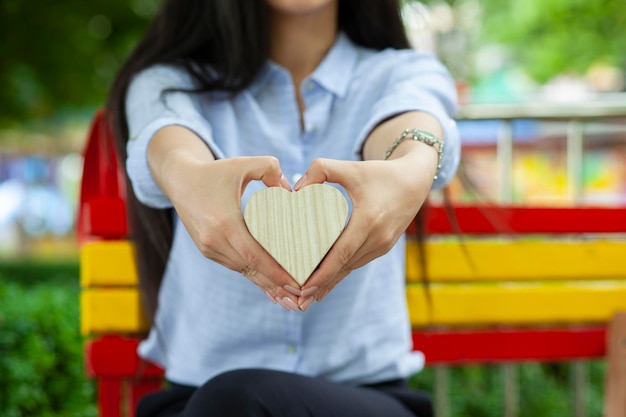 Woman hand heart in street