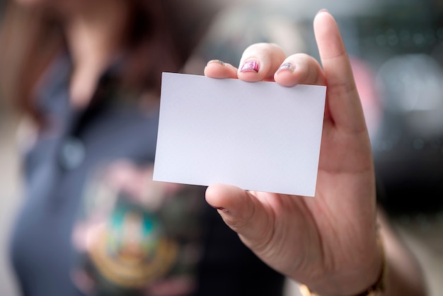 woman hand holding blank white card 