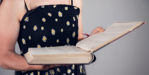 Woman hand holding a book to read