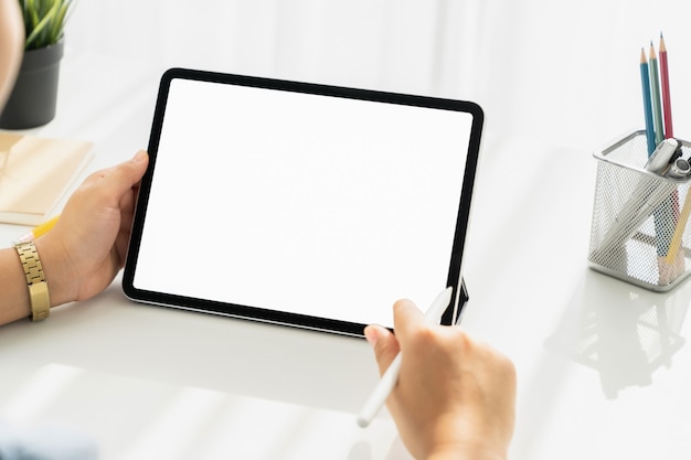 Woman hand holding digital tablet and the screen is blank