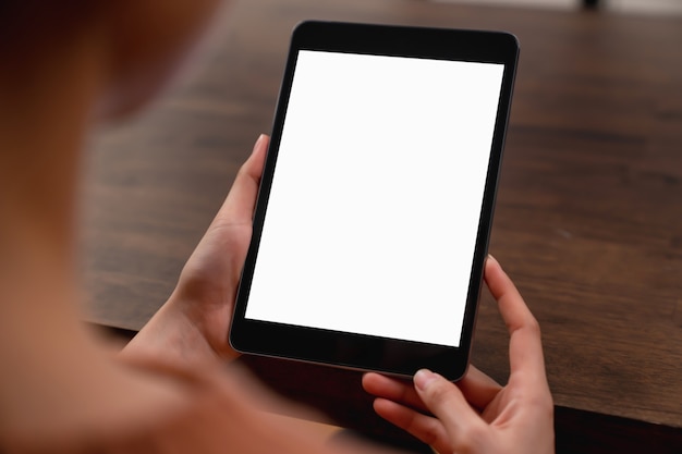 woman hand holding digital tablet and touching blank screen.