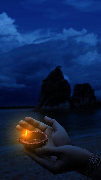 Woman hand holding Diya oil lamps for the Diwali festival Diwali Festival The Hindu Festival of Lights celebration