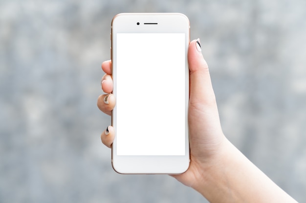 Woman hand holding mockup smartphone isolated white screen for app design or display