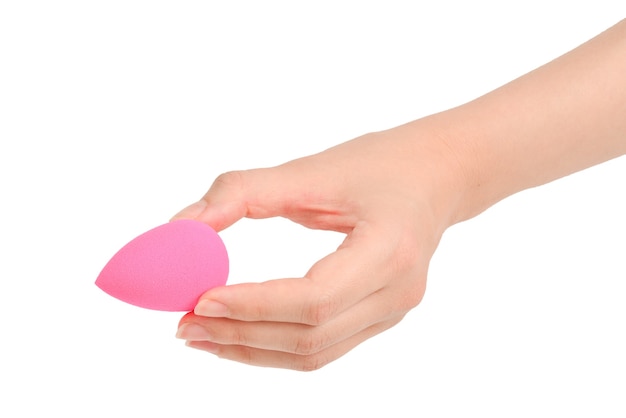 Woman hand holding pink beauty sponge isolated on white