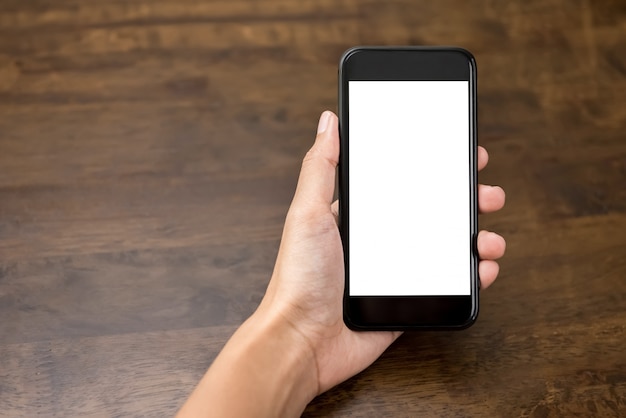 Woman hand holding smartphone with empty white screen 