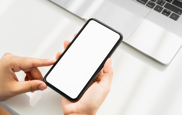 Woman hand holding smartphone