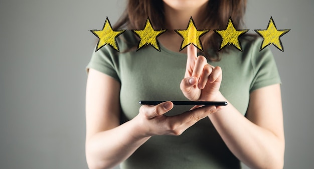 Woman hand holds tablet and stars