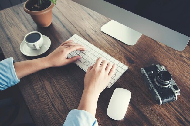 Woman hand keyboard with camera